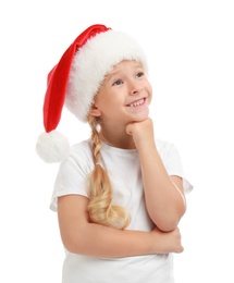 Cute little child wearing Santa hat on white background. Christmas holiday