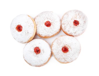 Delicious donuts with jelly and powdered sugar on white background, top view