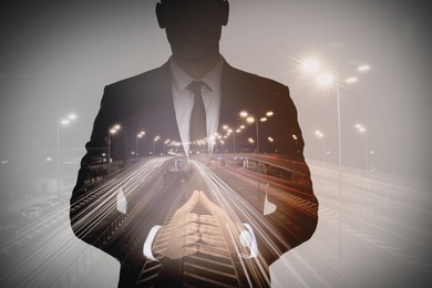 Double exposure of businessman and highway in night. Leadership concept