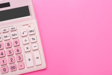 Modern calculator on pink background, top view. Space for text