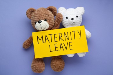 Photo of Toy bears and note with words Maternity Leave on violet background, top view