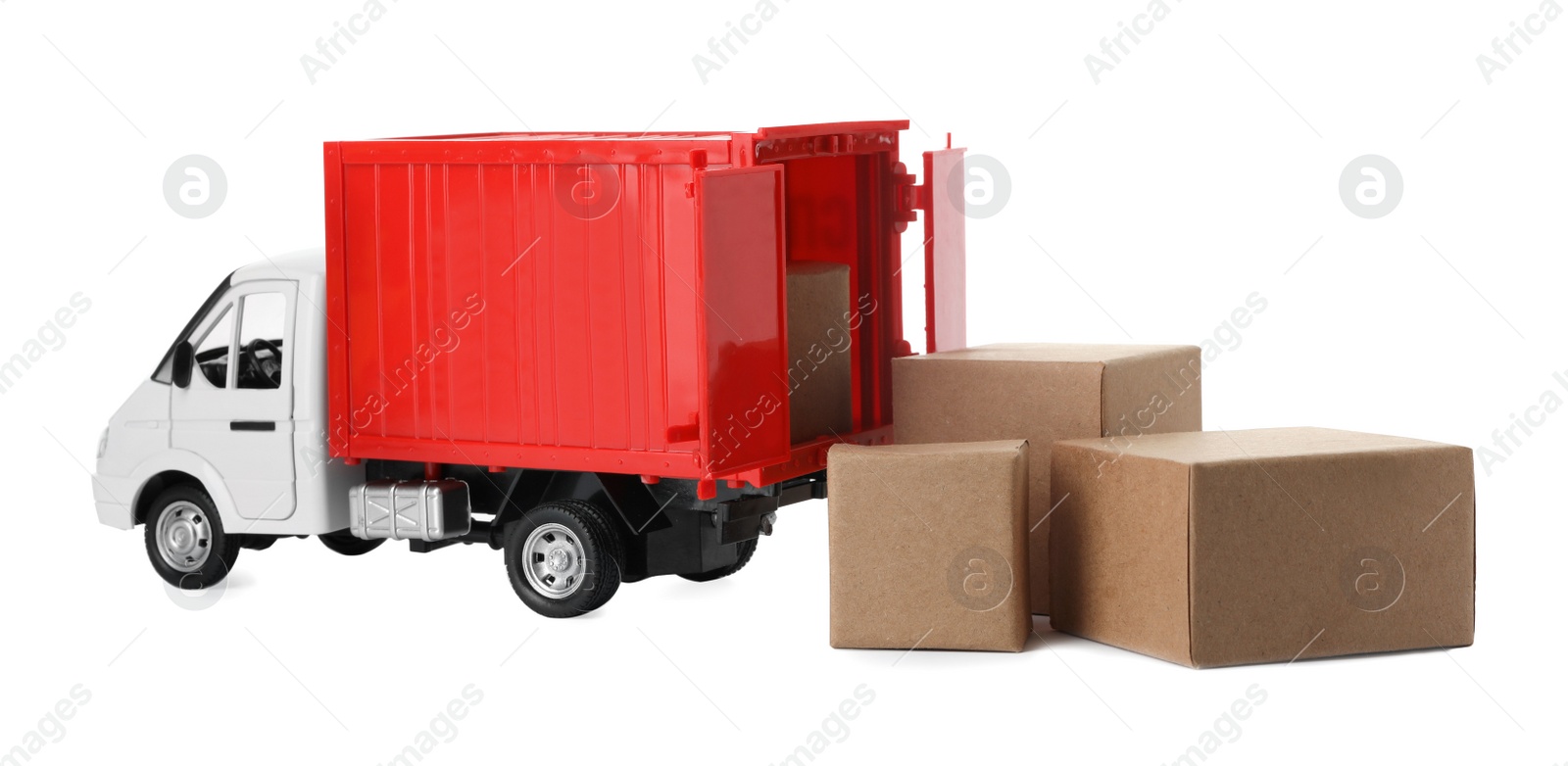 Photo of Toy truck with boxes isolated on white. Logistics and wholesale concept