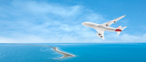 Modern airplane flying in sky over ocean, banner design