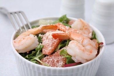 Photo of Delicious salad with pomelo, shrimps and tomatoes in bowl, closeup