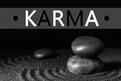 Image of Karma concept. Black sand and stones against dark background