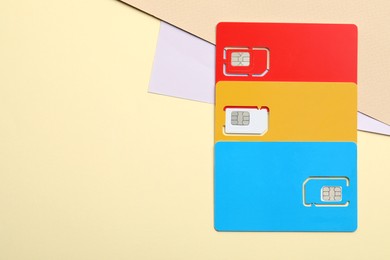 Photo of Different SIM cards on color background, flat lay. Space for text