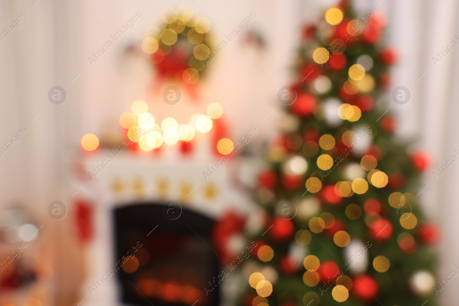 Photo of Blurred view of room with Christmas tree near fireplace