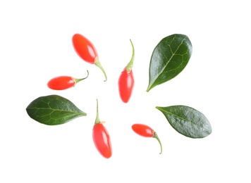 Photo of Fresh ripe goji berries and leaves on white background, top view