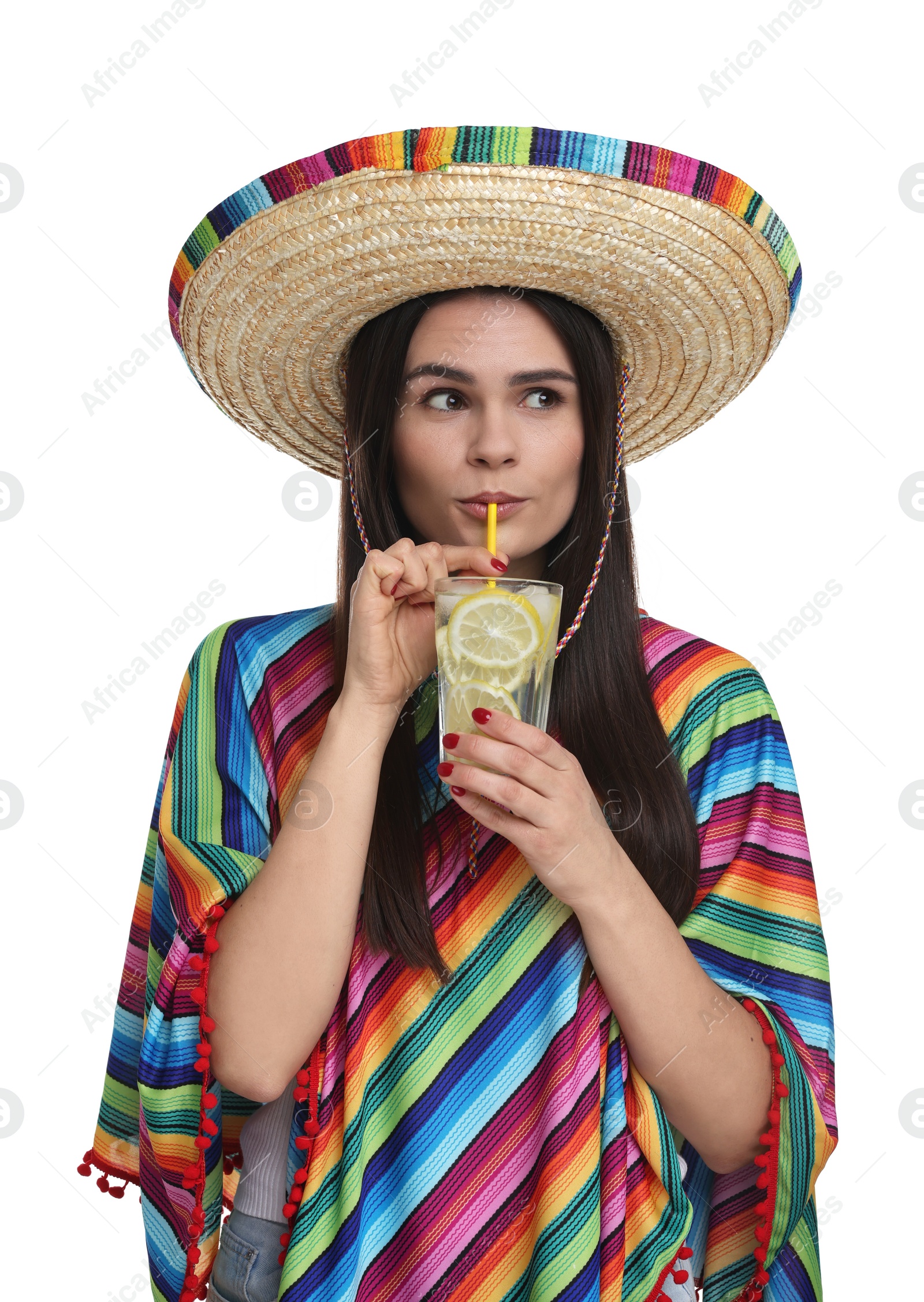 Photo of Young woman in Mexican sombrero hat and poncho drinking cocktail on white background