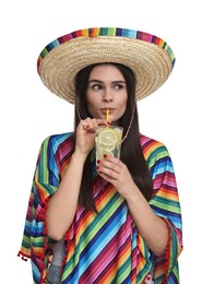 Photo of Young woman in Mexican sombrero hat and poncho drinking cocktail on white background