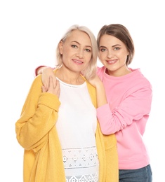 Portrait of mature woman and her daughter isolated on white