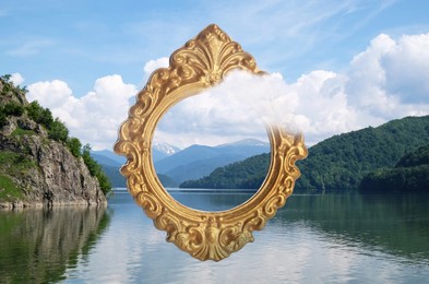 Image of Vintage frame and beautiful lake between mountains under blue sky with clouds