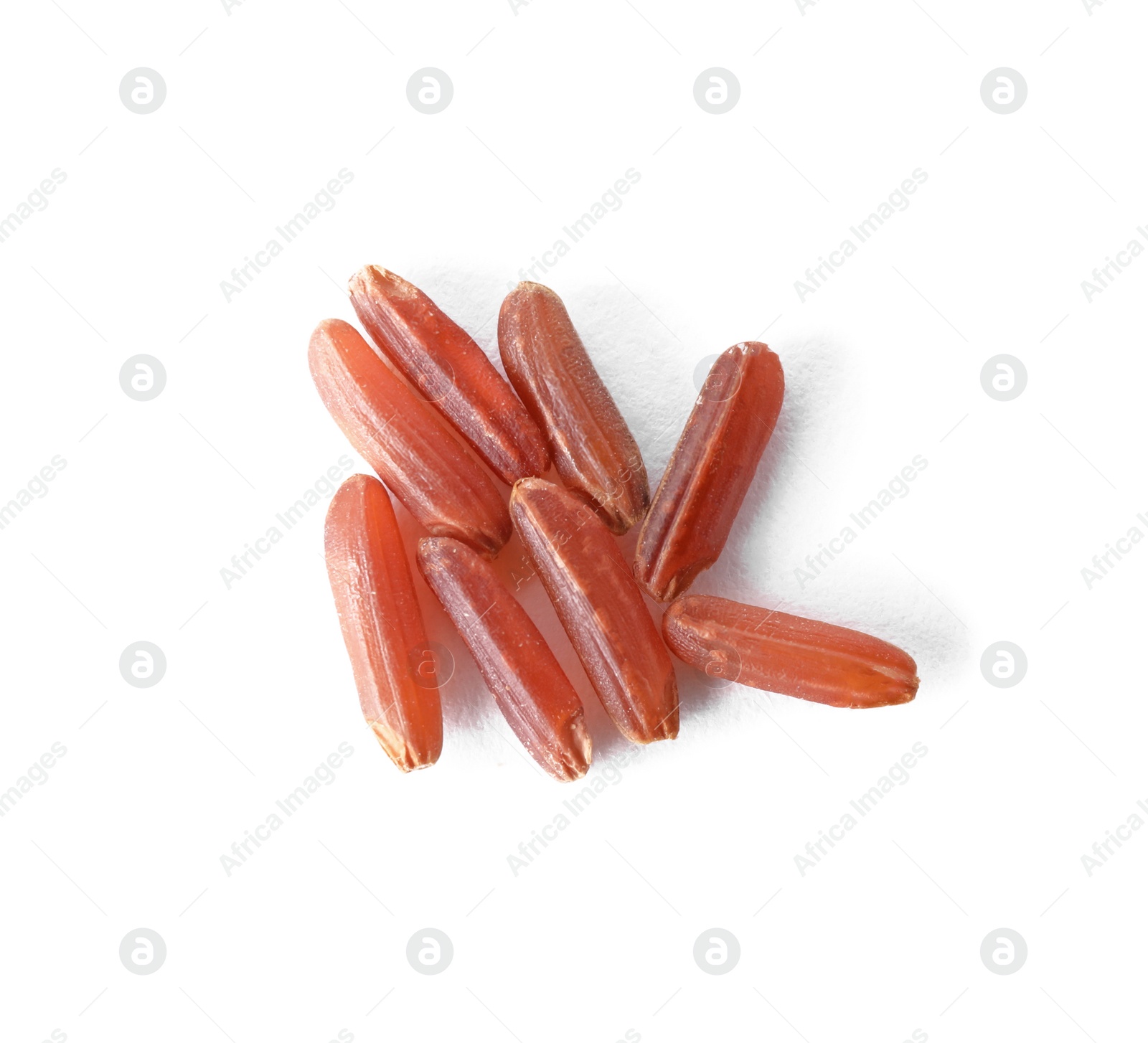 Photo of Uncooked brown rice isolated on white, top view