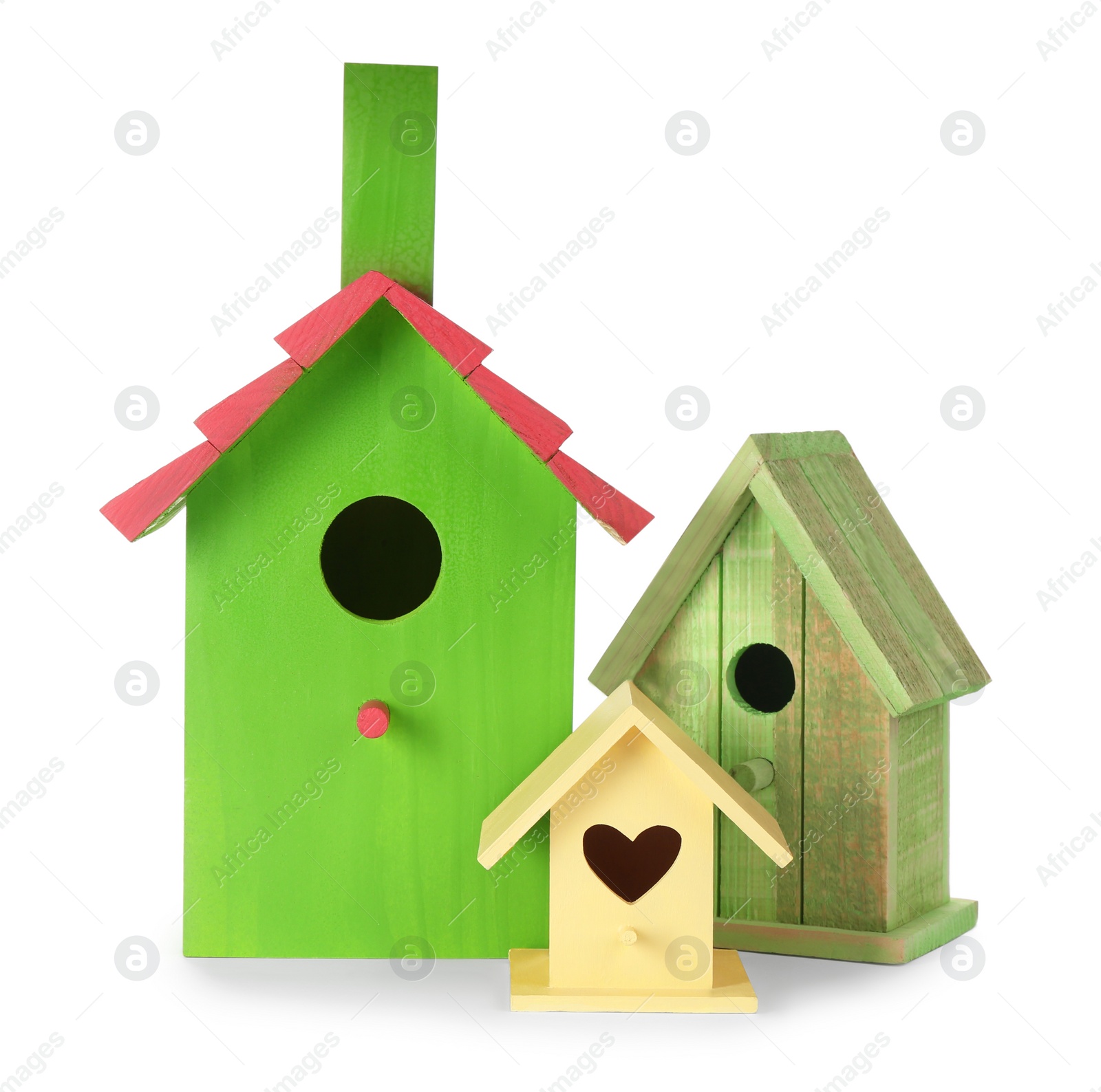 Photo of Three different bird houses on white background