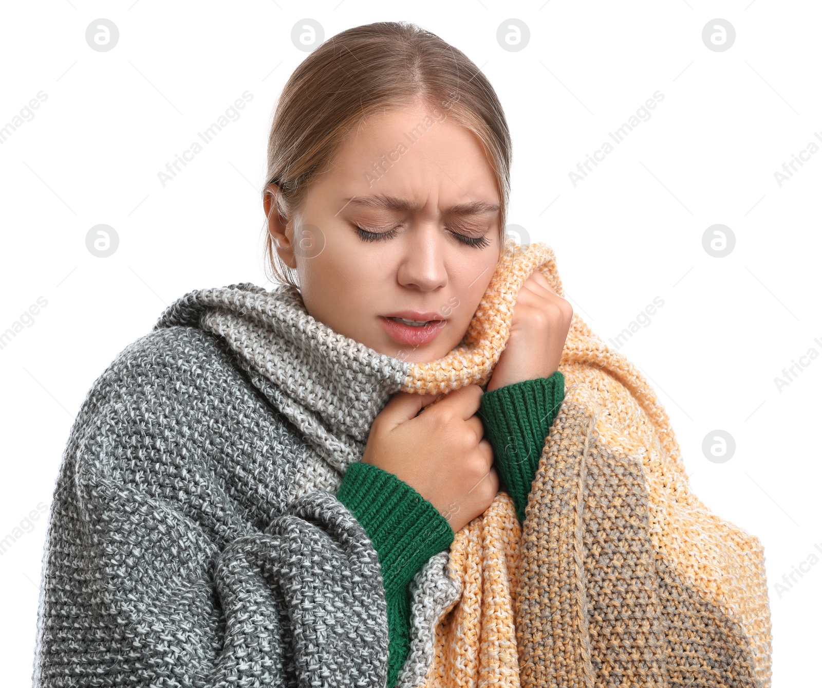 Photo of Young woman wrapped in warm blanket suffering from cold on white background