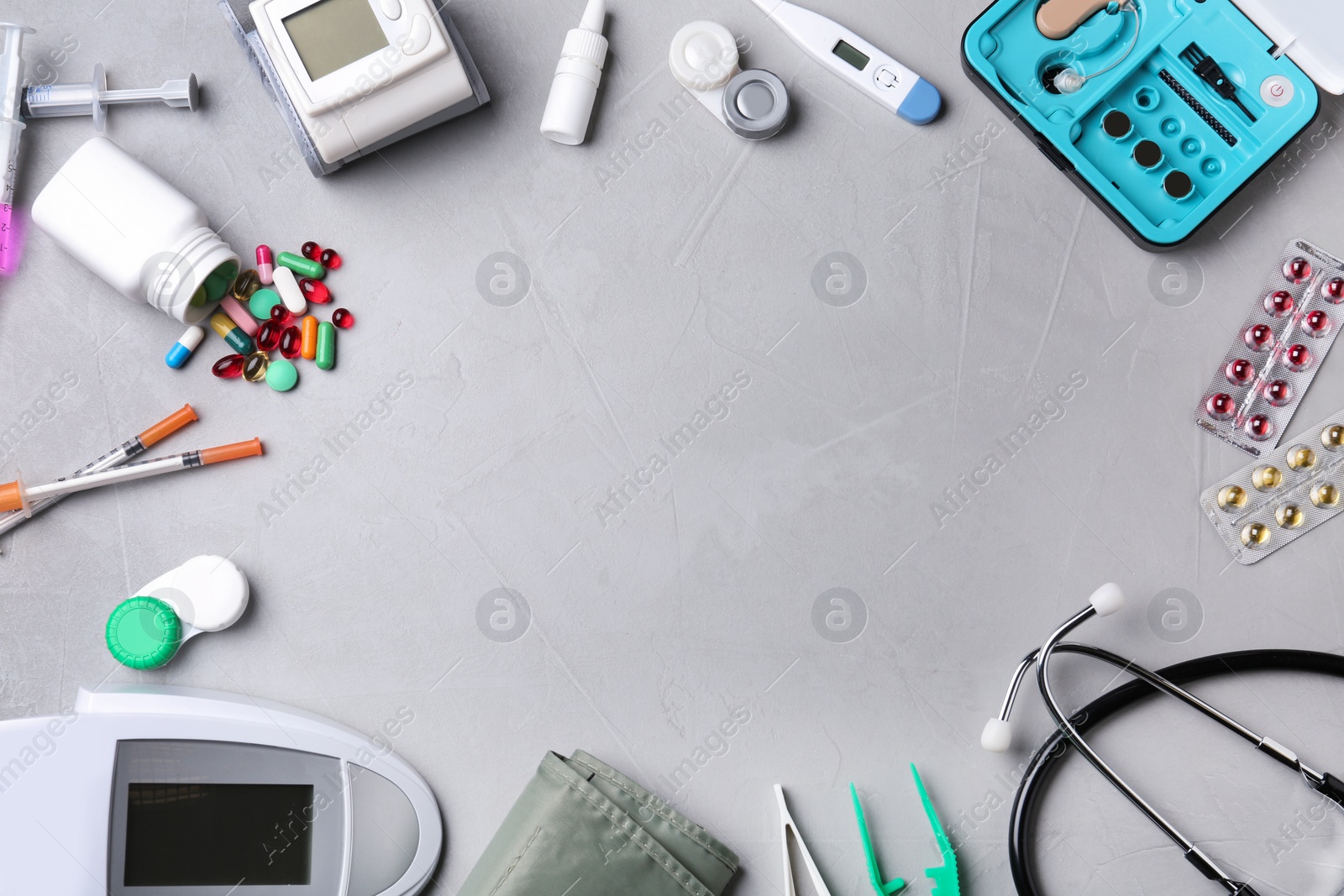 Photo of Flat lay composition with medical objects and space for text on grey background