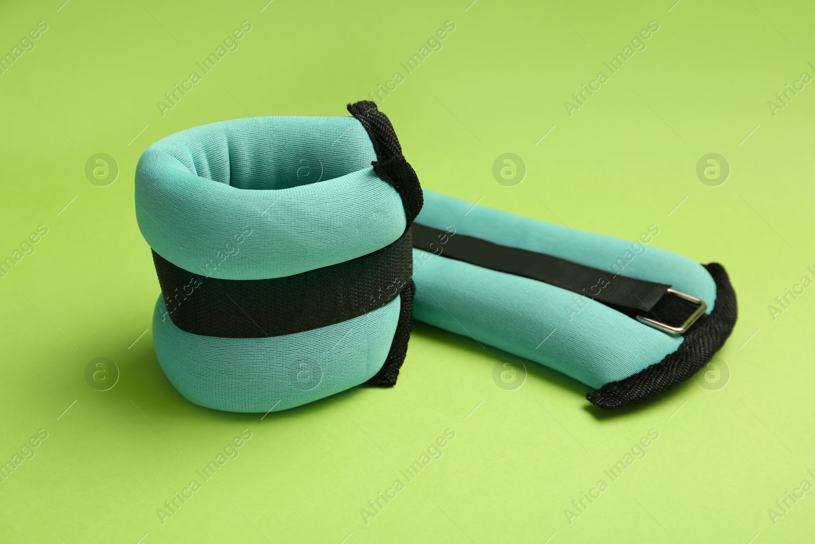 Photo of Turquoise weighting agents on light green background