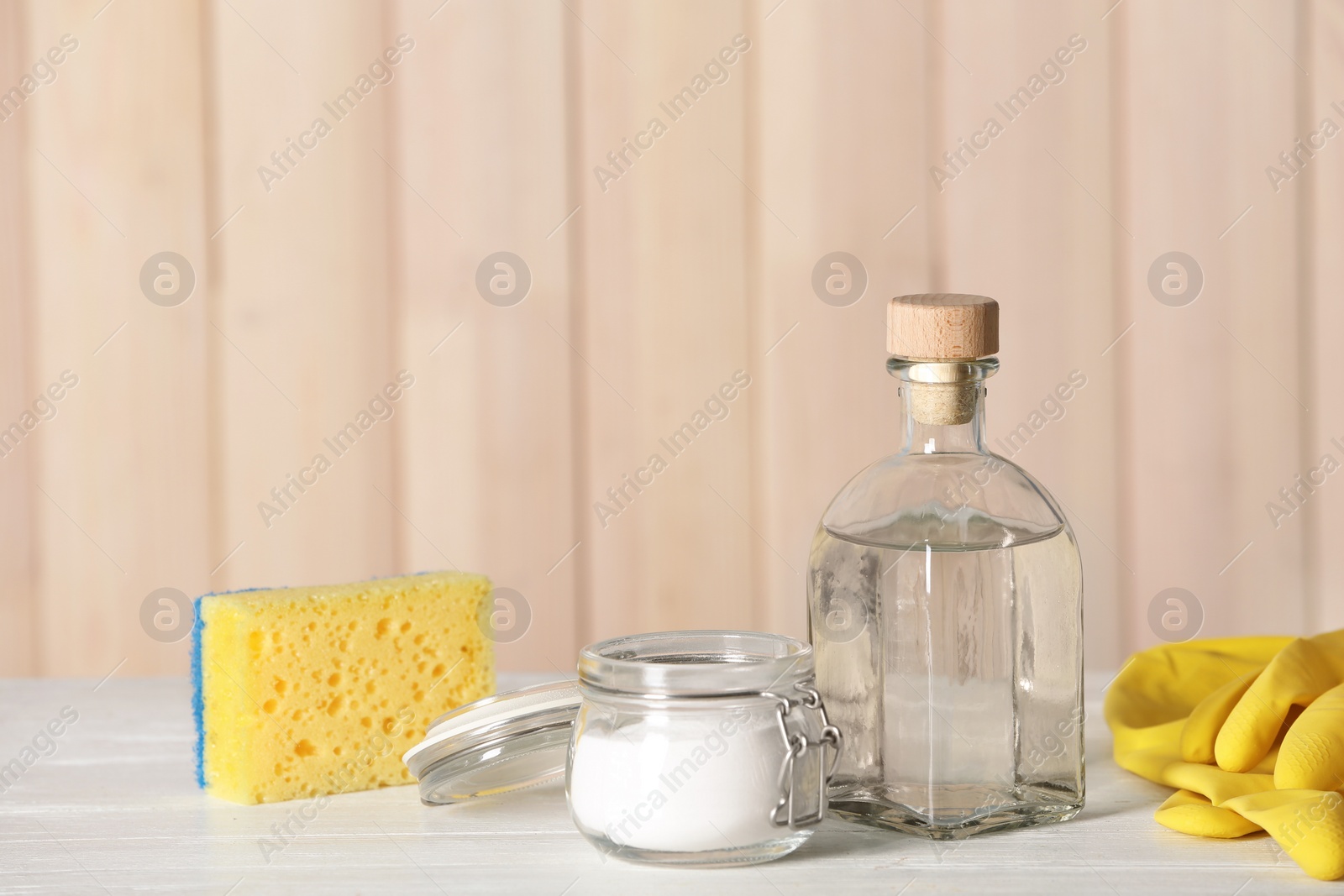 Photo of Composition with vinegar, baking soda and cleaning supplies on table