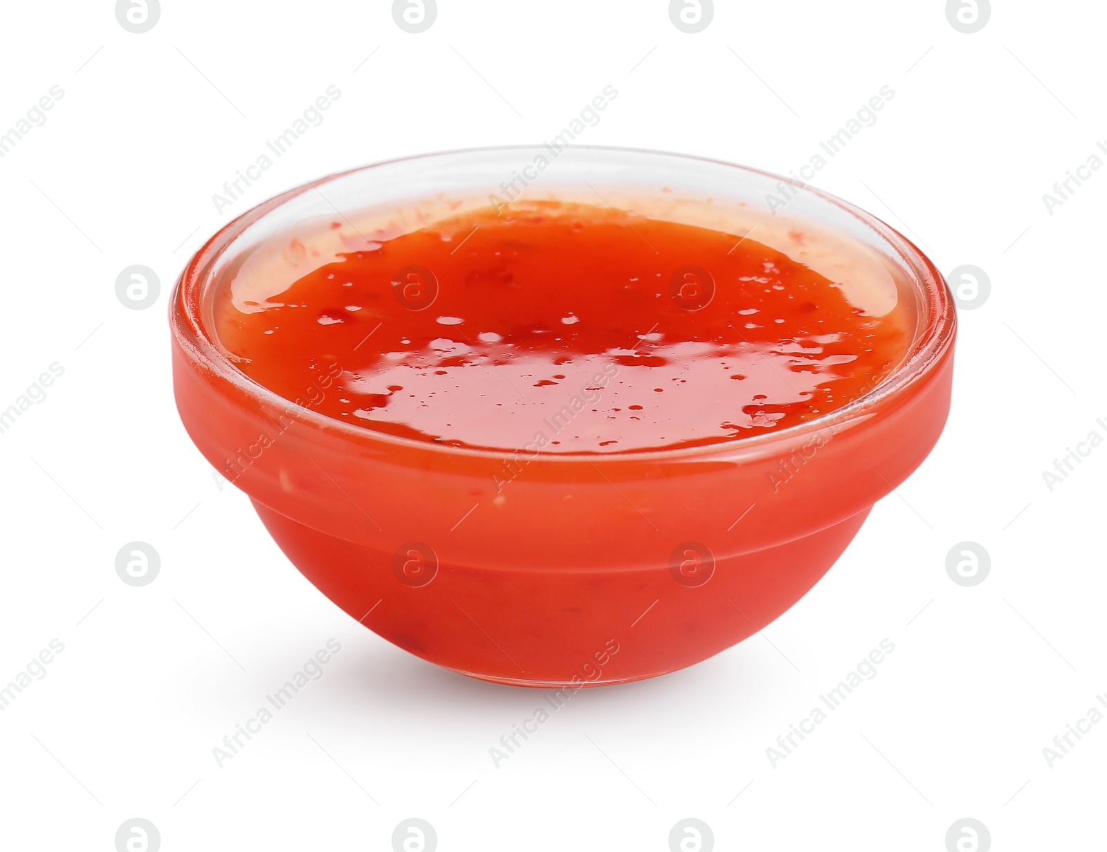 Photo of Spicy chili sauce in bowl isolated on white