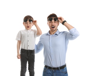 Photo of Portrait of emotional dad and his son isolated on white