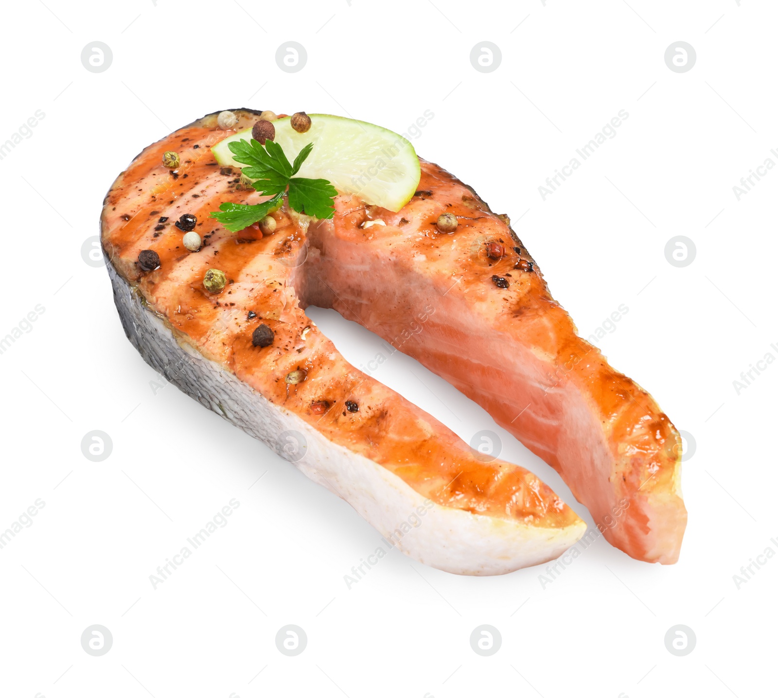 Photo of Tasty salmon steak with lemon, peppercorns and parsley isolated on white