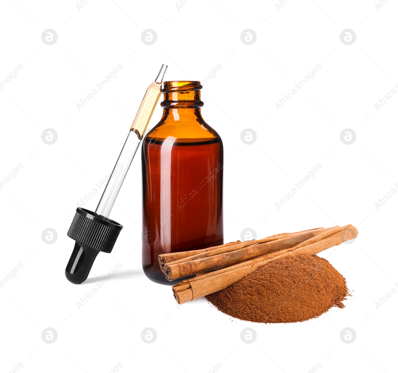 Image of Bottle of natural essential oil, dry cinnamon sticks and powder on white background