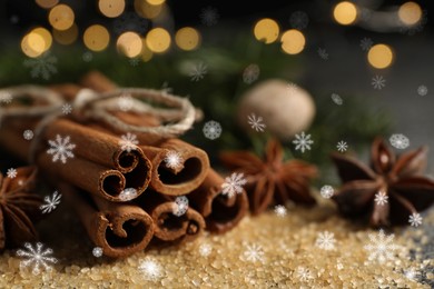 Different spices on table, closeup. Cinnamon, anise, brown sugar. Bokeh effect