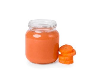 Photo of Jar of healthy baby food and carrot slices on white background