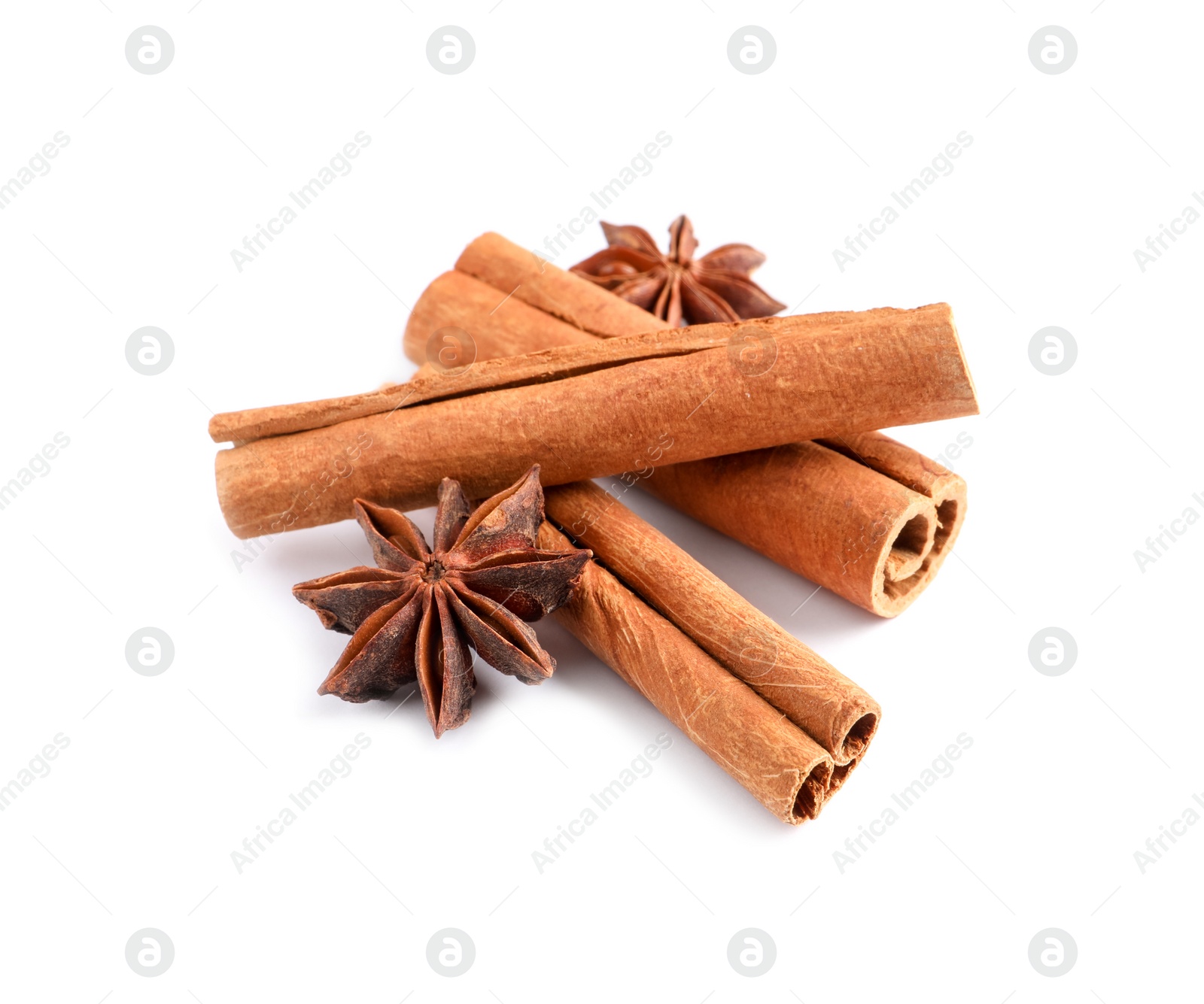 Photo of Cinnamon sticks and anise stars isolated on white