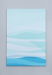 Photo of Beautiful abstract painting hanging on grey wall