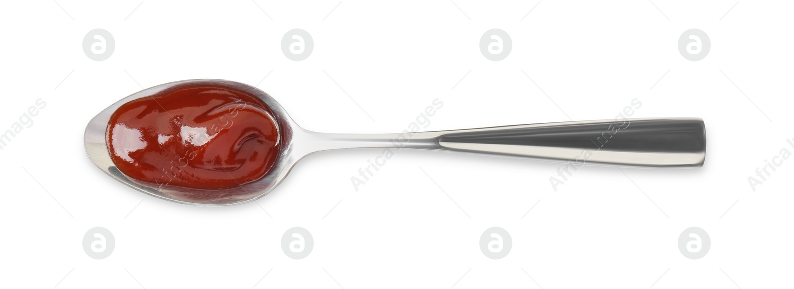 Photo of Tasty barbecue sauce in spoon isolated on white, top view