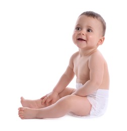 Photo of Cute baby in dry soft diaper sitting isolated on white