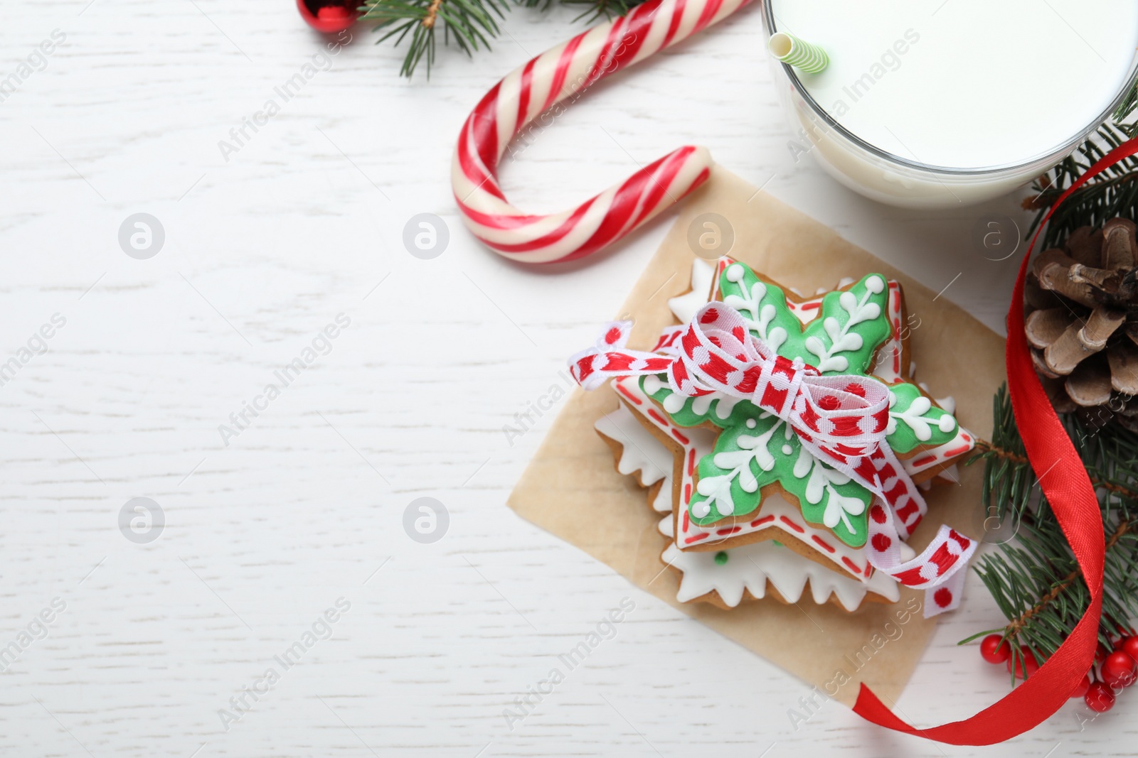 Photo of Delicious Christmas cookies on white wooden table, flat lay. Space for text