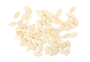 Photo of Raw unpeeled pumpkin seeds on white background, top view