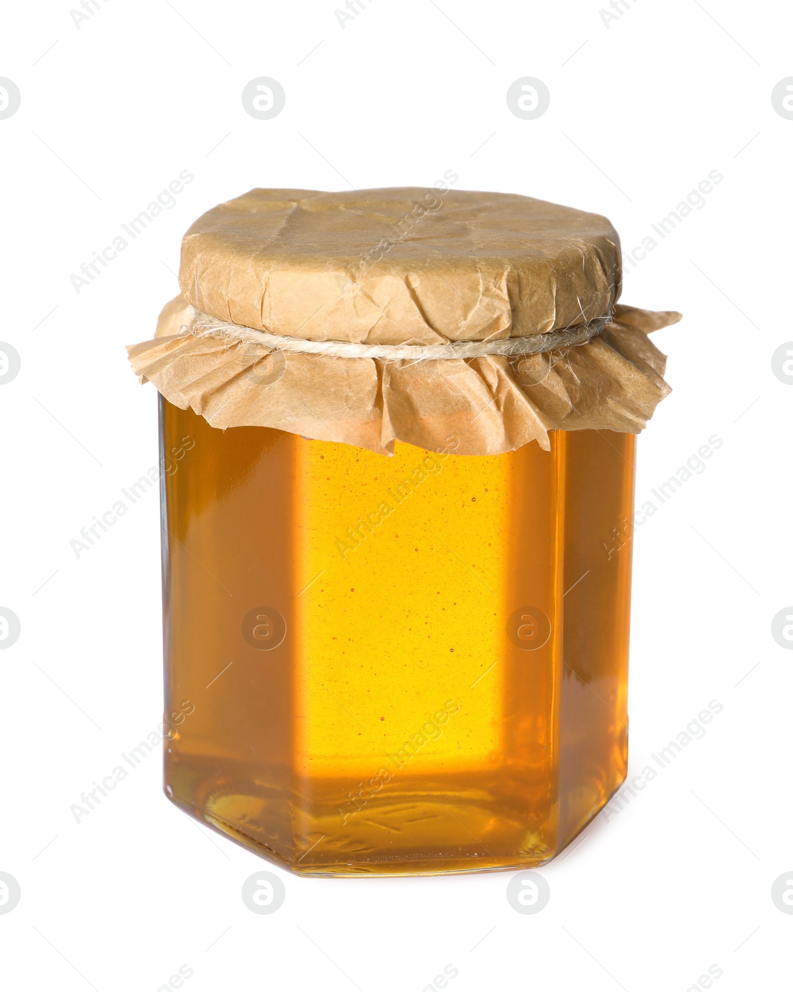 Photo of Tasty natural honey in glass jar isolated on white