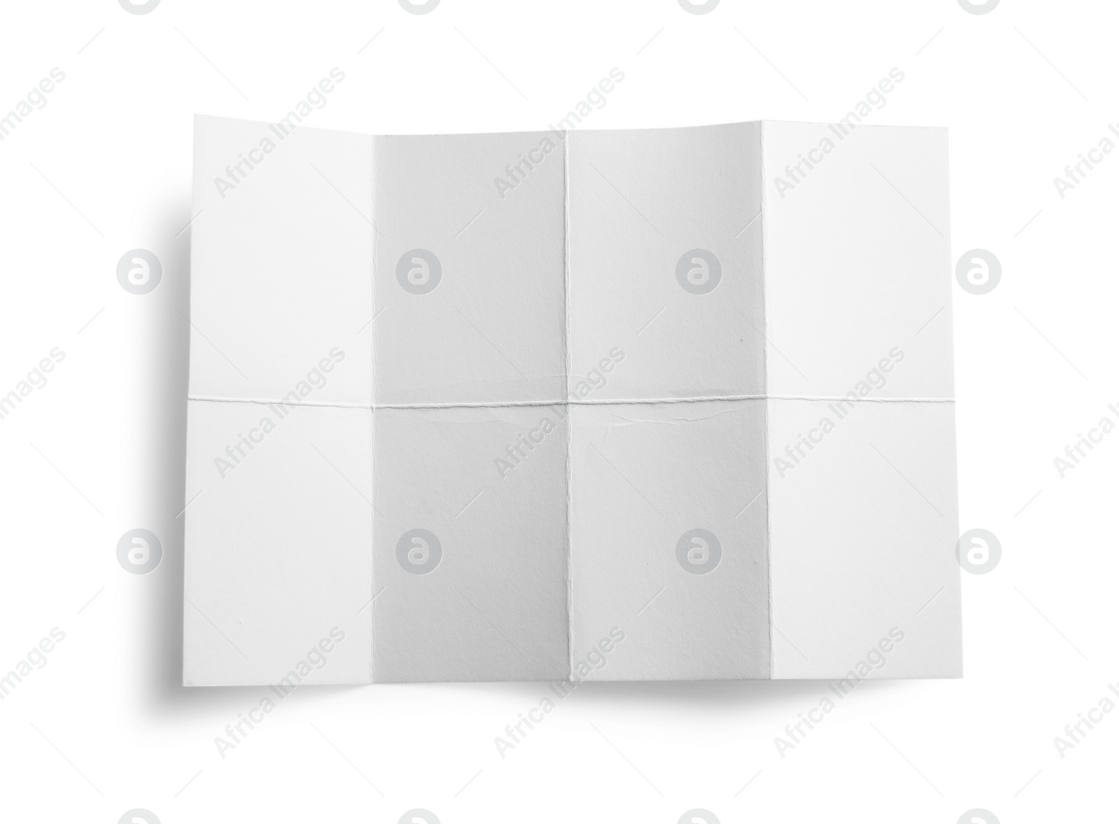Photo of Blank paper sheet with creases isolated on white, top view