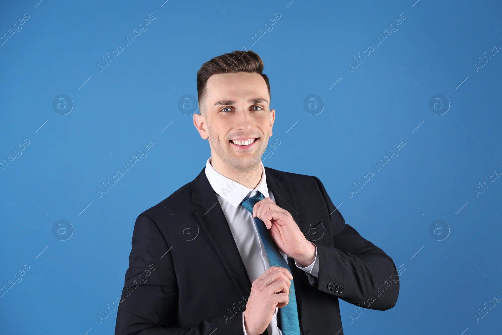 Photo of Portrait of young man with beautiful hair on color background