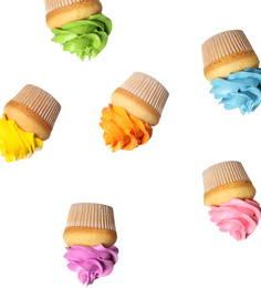 Set of falling delicious birthday cupcakes on white background