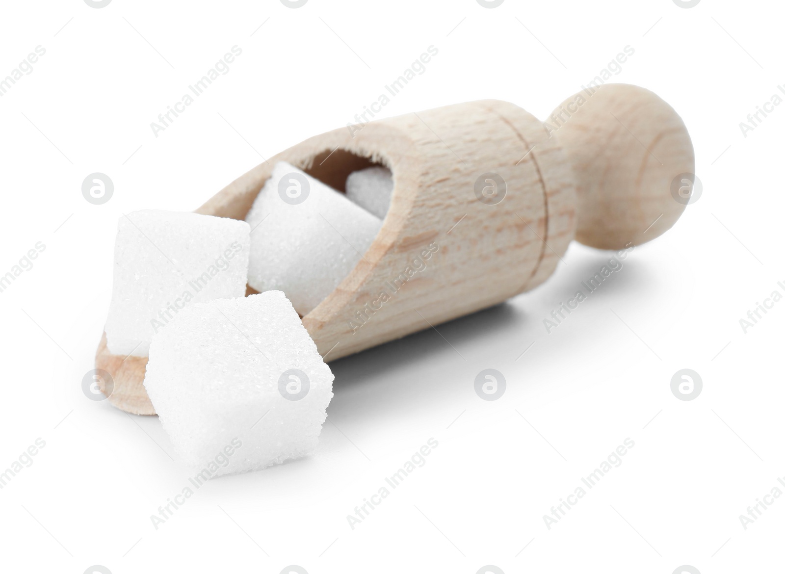 Photo of Sugar cubes in wooden scoop isolated on white