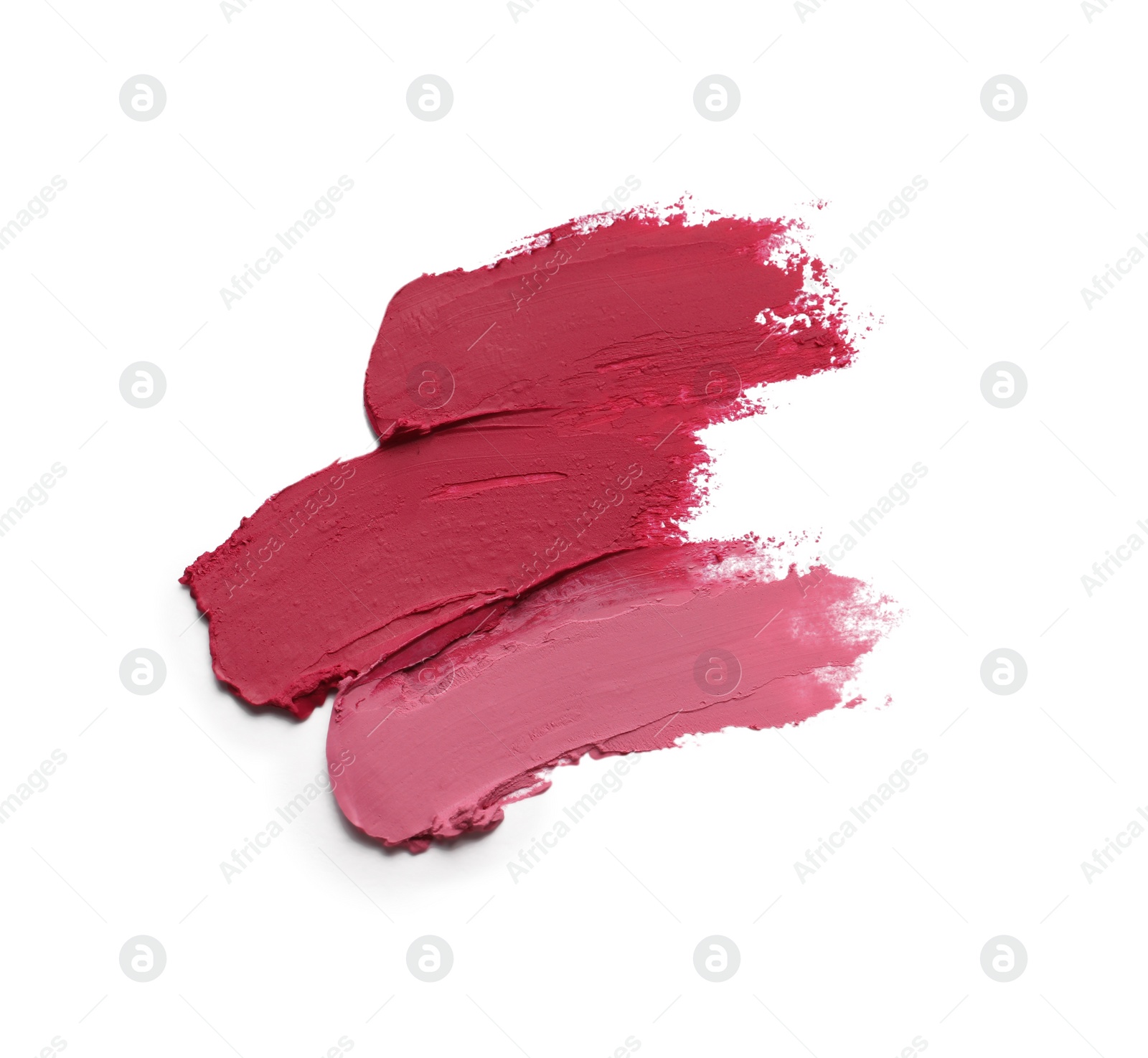 Photo of Smears of beautiful lipsticks on white background, top view