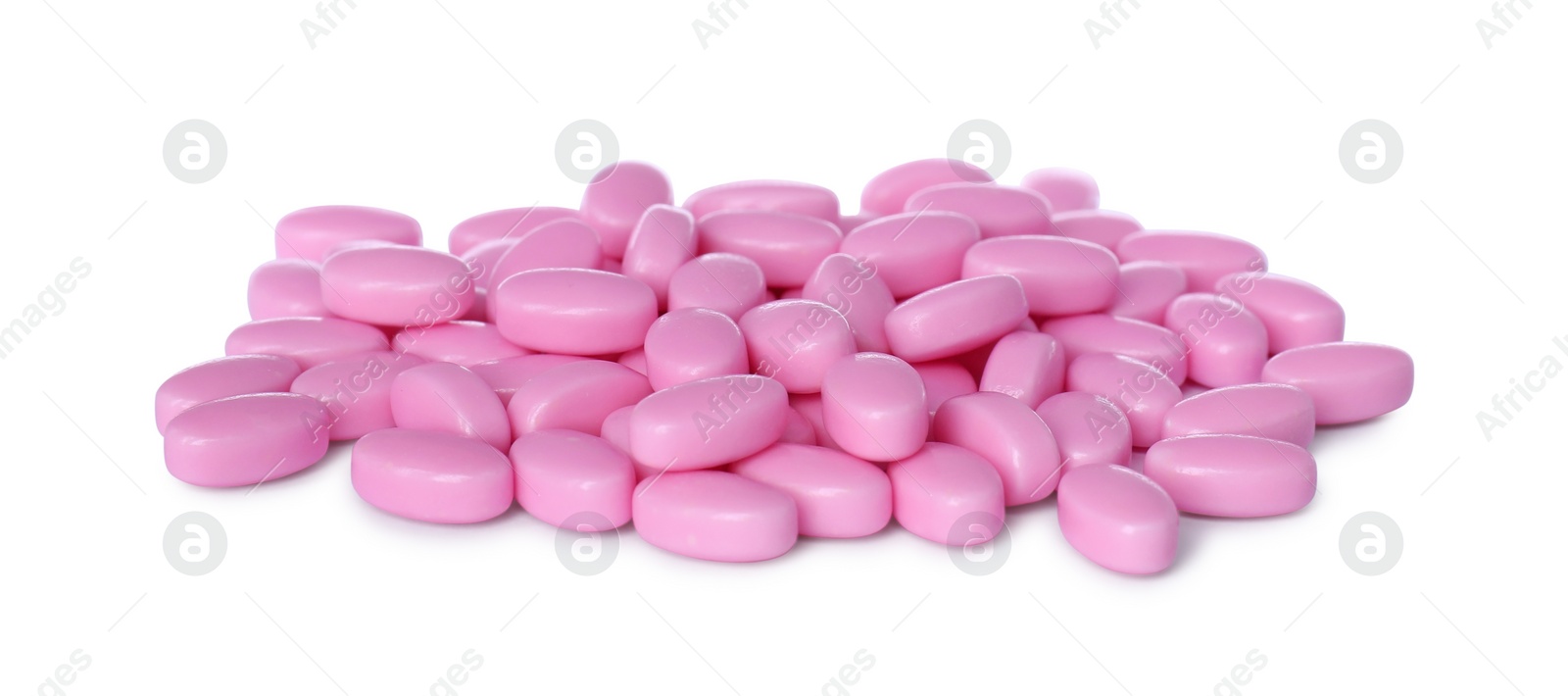 Photo of Tasty pink dragee candies on white background