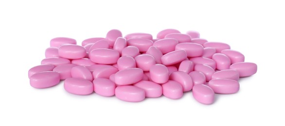 Photo of Tasty pink dragee candies on white background
