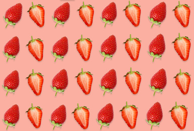 Image of Pattern of whole and halved strawberries on pale pink background