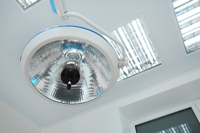 Powerful surgical lamp in modern operating room