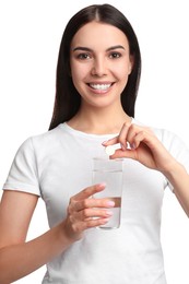 Photo of Young woman with glass of water and vitamin pill on white background