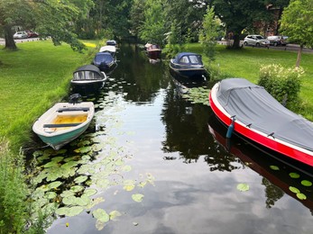 Beautiful view of moored boats in canal on sunny day