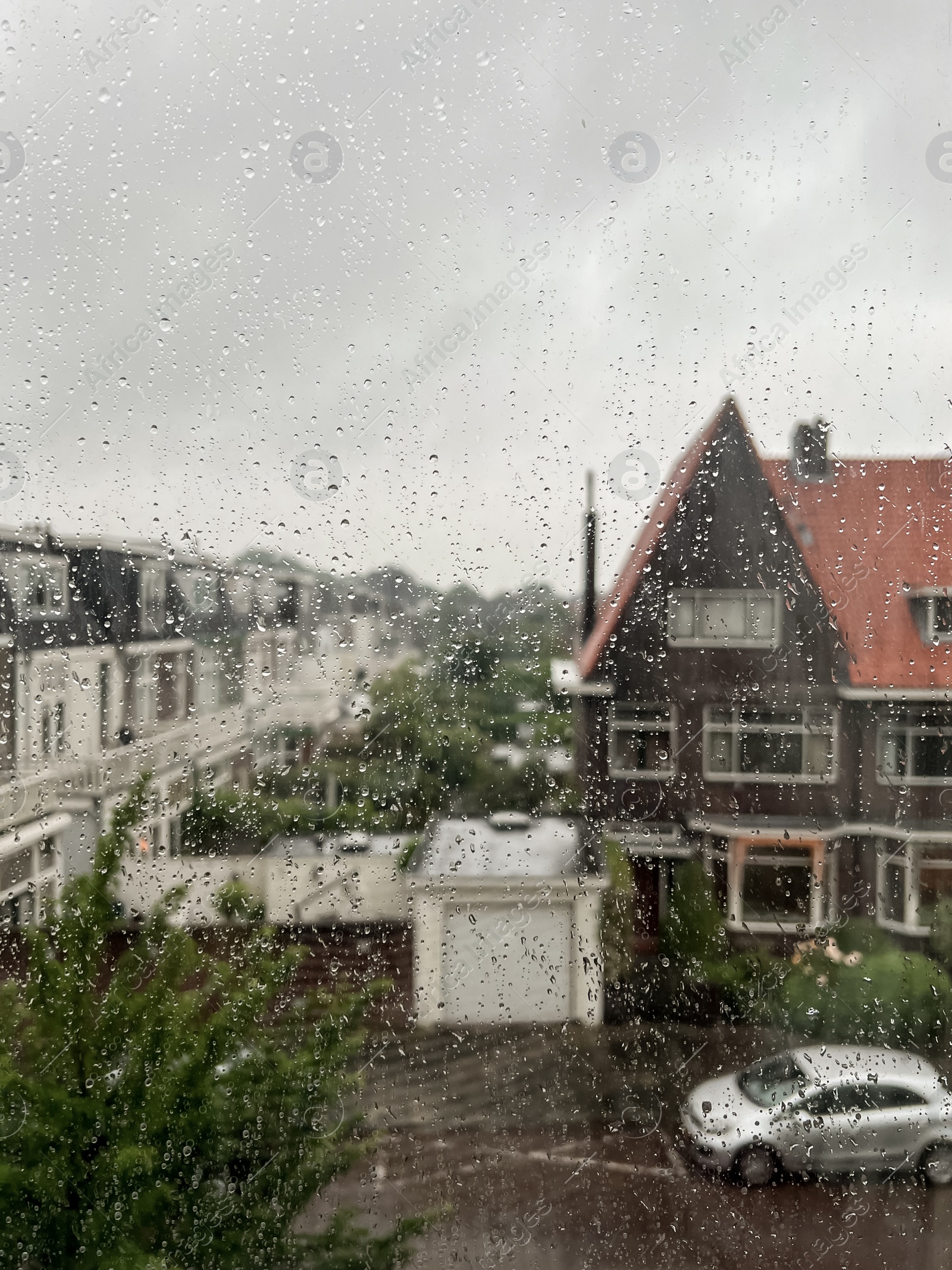 Photo of Window glass with water drops, view from inside. Rainy weather