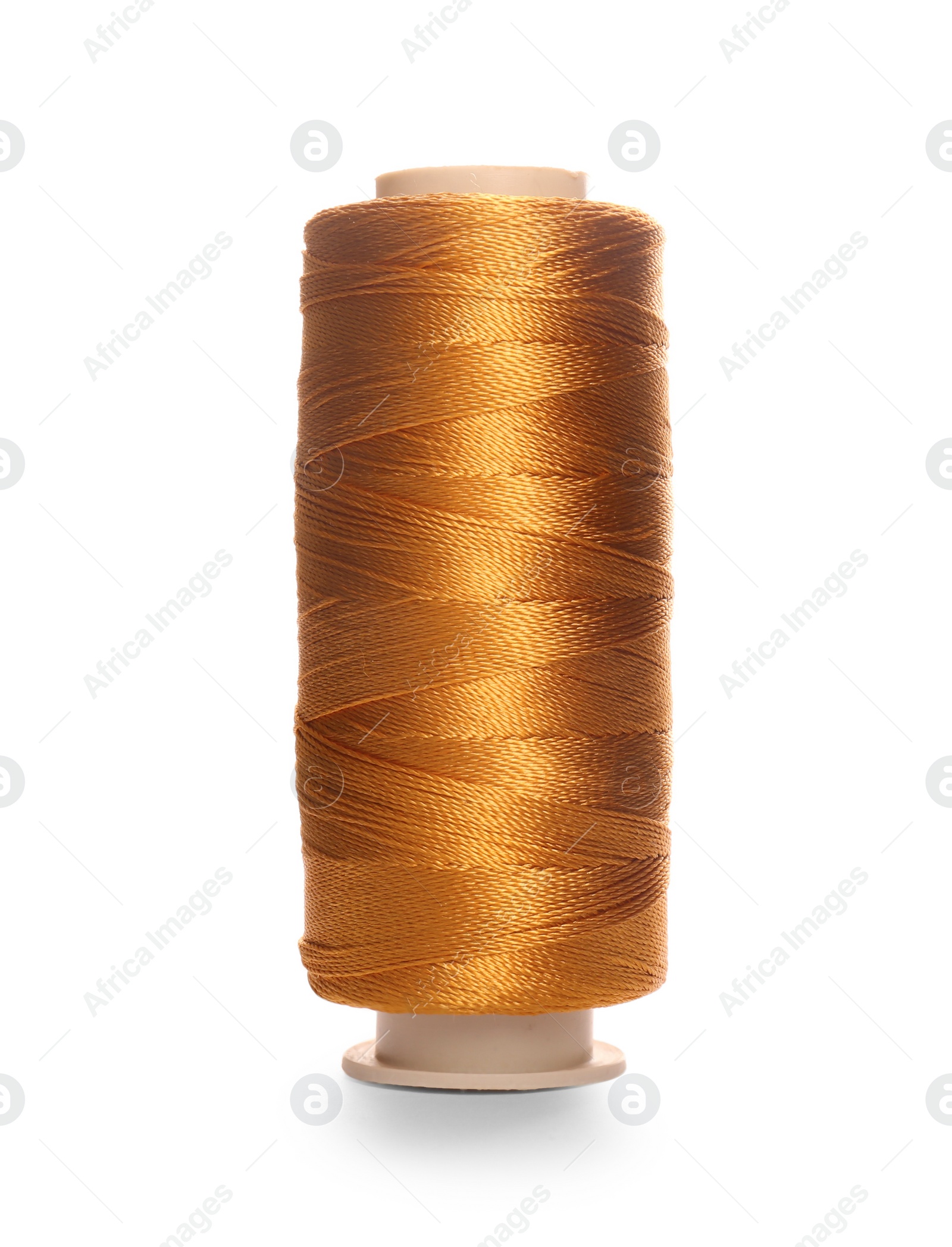 Photo of Spool of dark orange sewing thread isolated on white