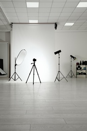 Photo studio interior with set of professional equipment