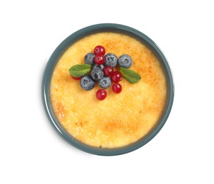 Delicious creme brulee with fresh berries isolated on white, top view